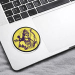 Laptop with a sticker of a deity on the palm rest area