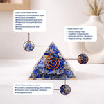 Triangular crystal with Lapis Lazuli, copper spiral coil, and metal flakes on a white background