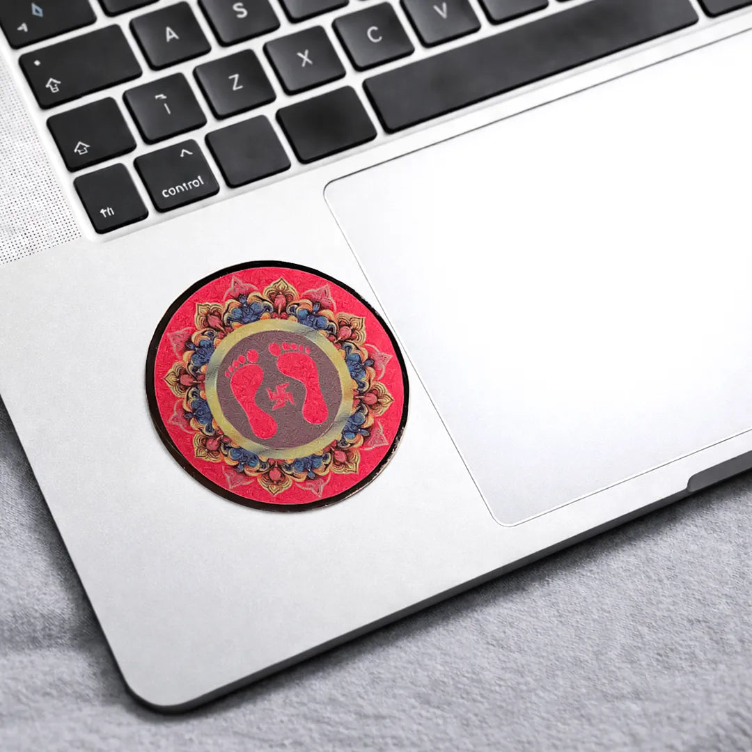 Decorative round sticker with feet design on a laptopGoddess Laxmi Feet Sticker (Pack of 10pcs) - Lakshmi Charan