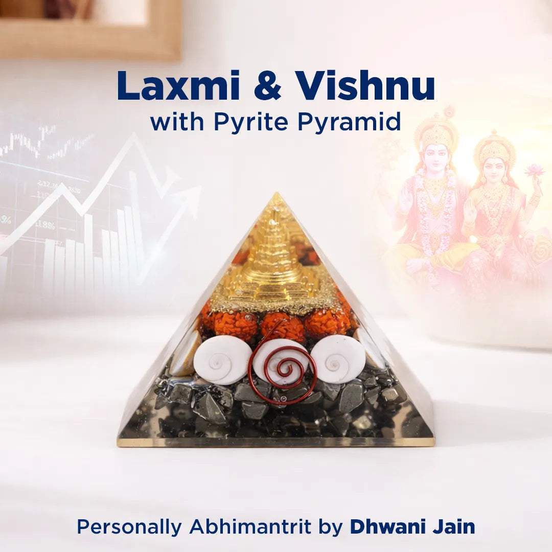 Pyrite pyramid with Laxmi and Vishnu statues on a white background