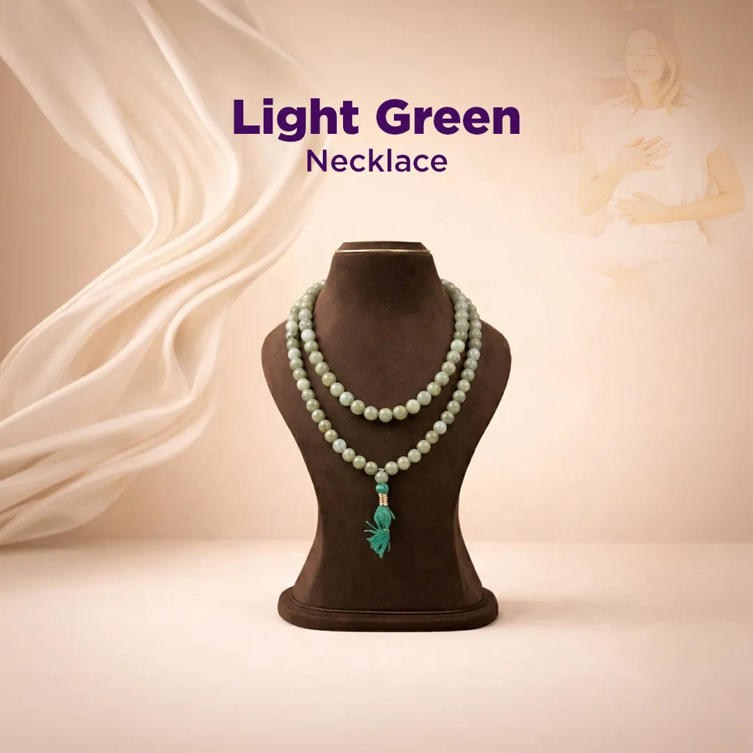 Light green necklace on a brown mannequin with a beige background