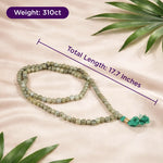 Meditation necklace with measurement details on a beige background with leaves.