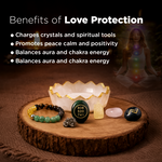 Collection of crystals and a bracelet on a wooden stand with text about love protection benefits.