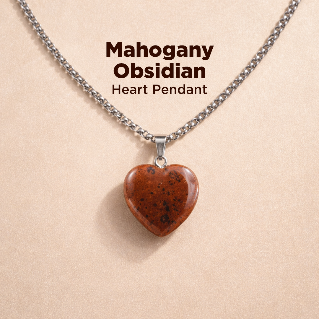 Heart-shaped mahogany obsidian pendant on a chain against a beige background