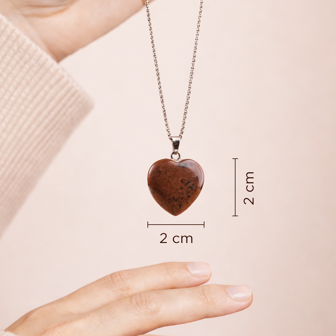 Heart-shaped pendant necklace with measurement details on a plain background