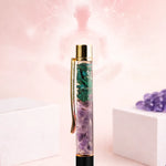 Decorative water bottle with green leaf design on a pink background