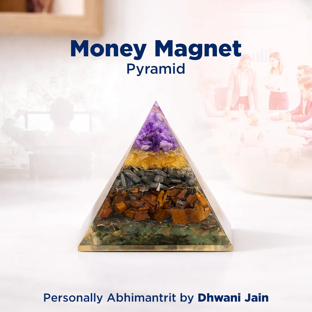 Crystal pyramid with colored stones on a white surface, labeled 'Money Magnet Pyramid' by Dhwani Jain.