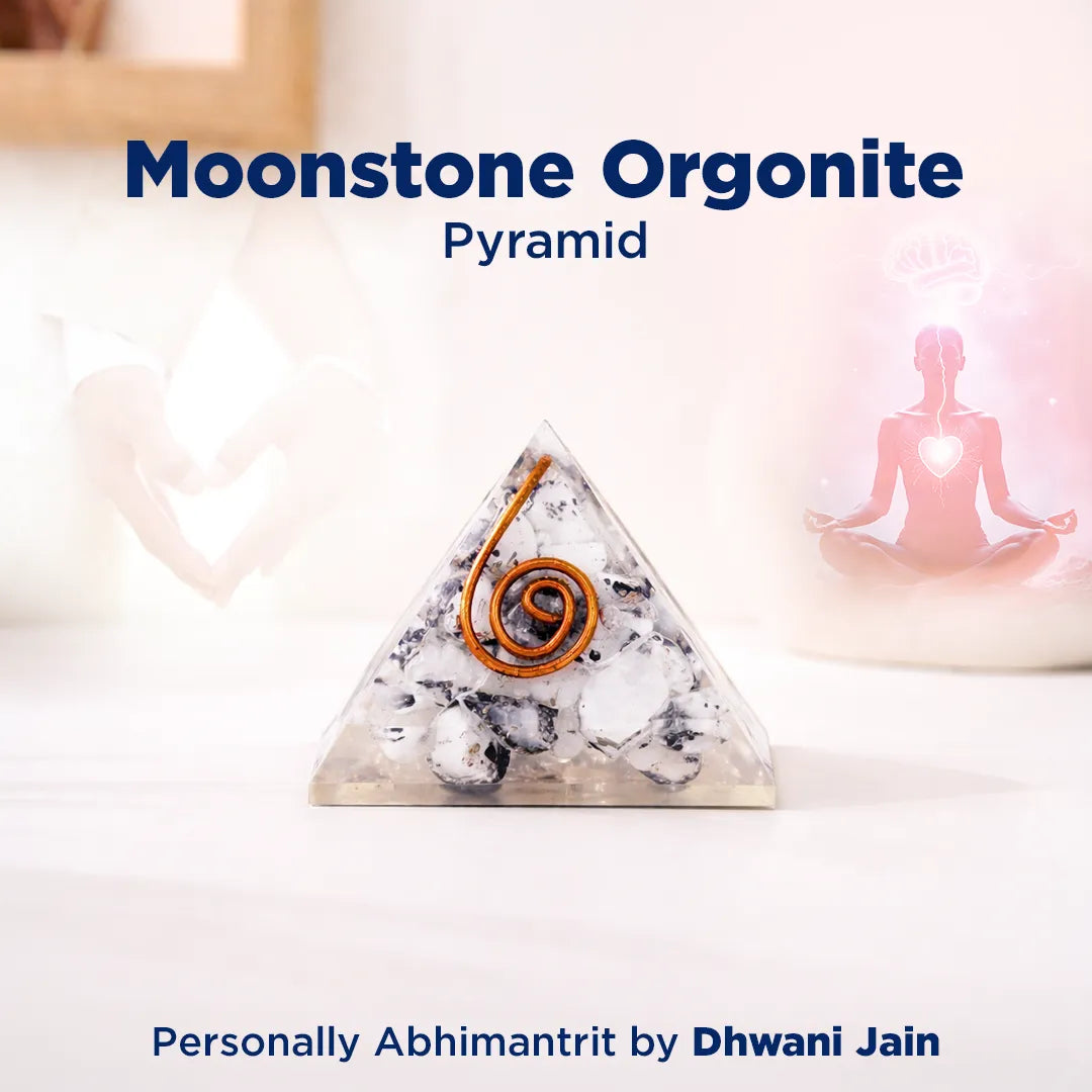 Moonstone Orgonite Pyramid with a blurred background of a person in meditation