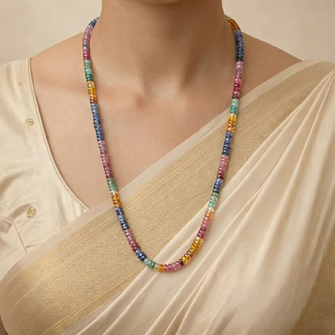 Multicolored beaded necklace worn by a person in a beige outfit.Multi Sapphire Single Line Necklace for Balance, Clarity & Success