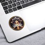 Decorative sticker with a lotus flower and Om symbol on a laptop