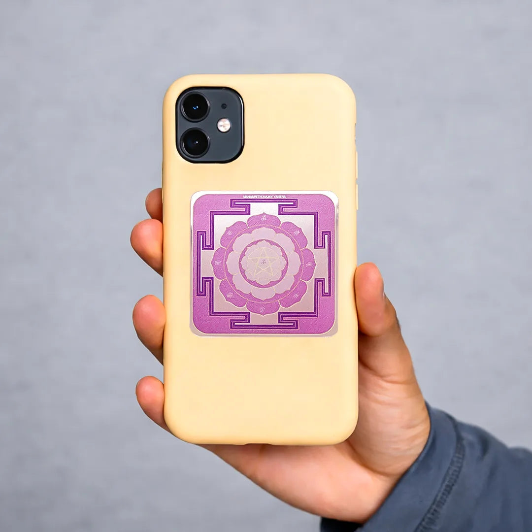 Hand holding a yellow phone case with a purple mandala design on a gray backgroundPurple Mahamrityunjay Sticker (Pack of 10pcs) - Shiva Protection Mantra