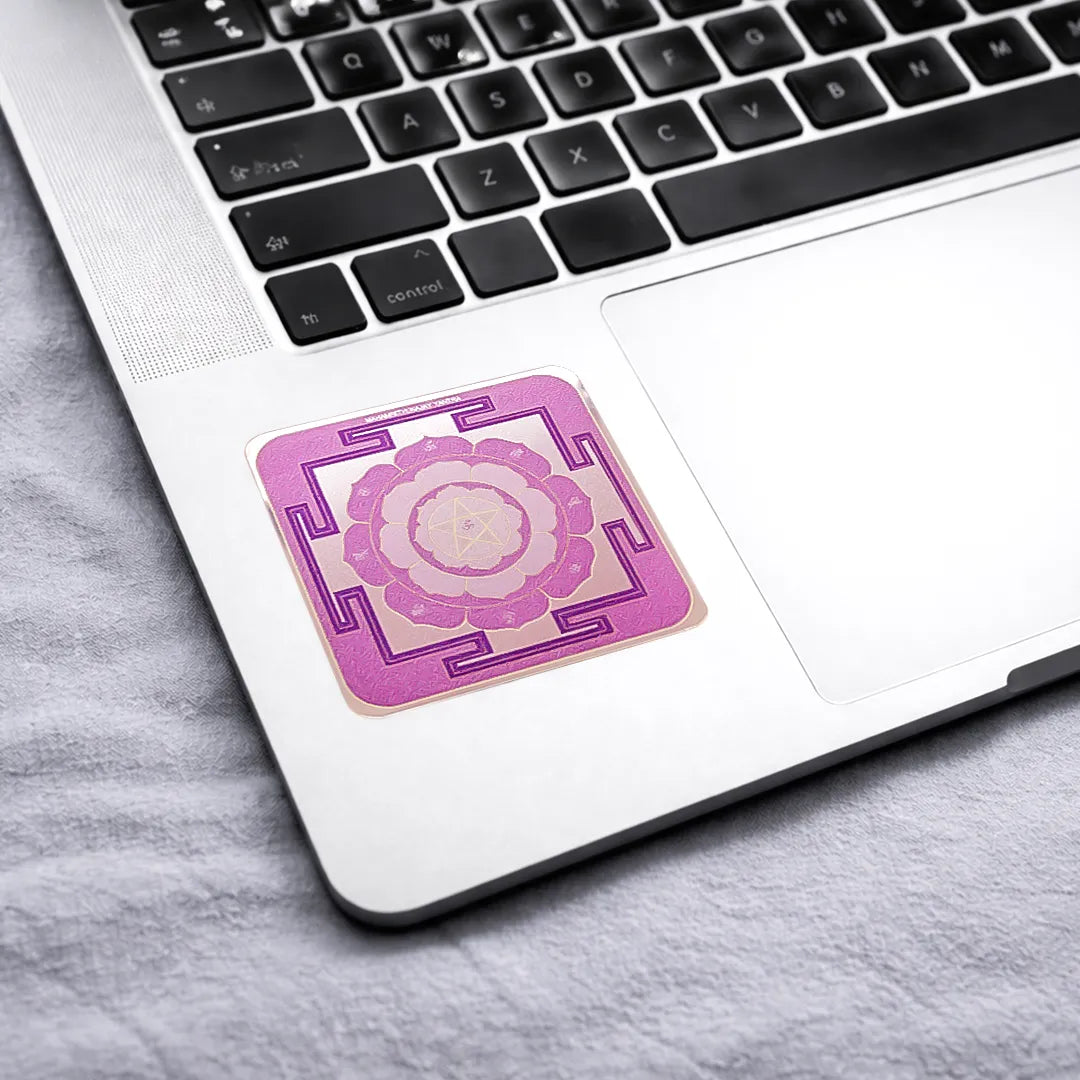 Pink mandala sticker on a laptop keyboard