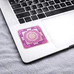Pink mandala sticker on a laptop keyboard