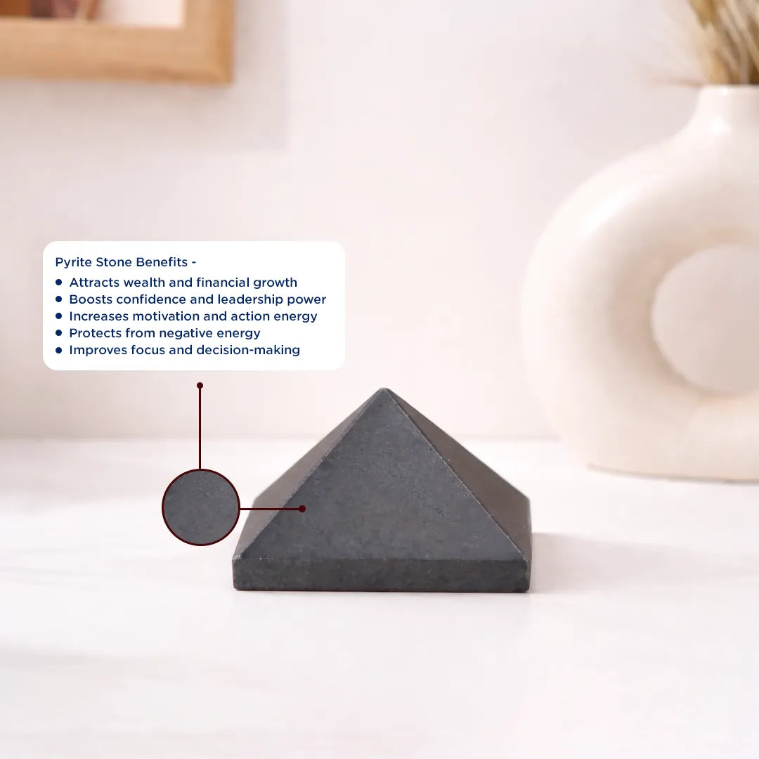 Pyrite stone pyramid with benefits listed on a white surfacePyrite Small Pyramid – Wealth Attraction & Protection Crystal