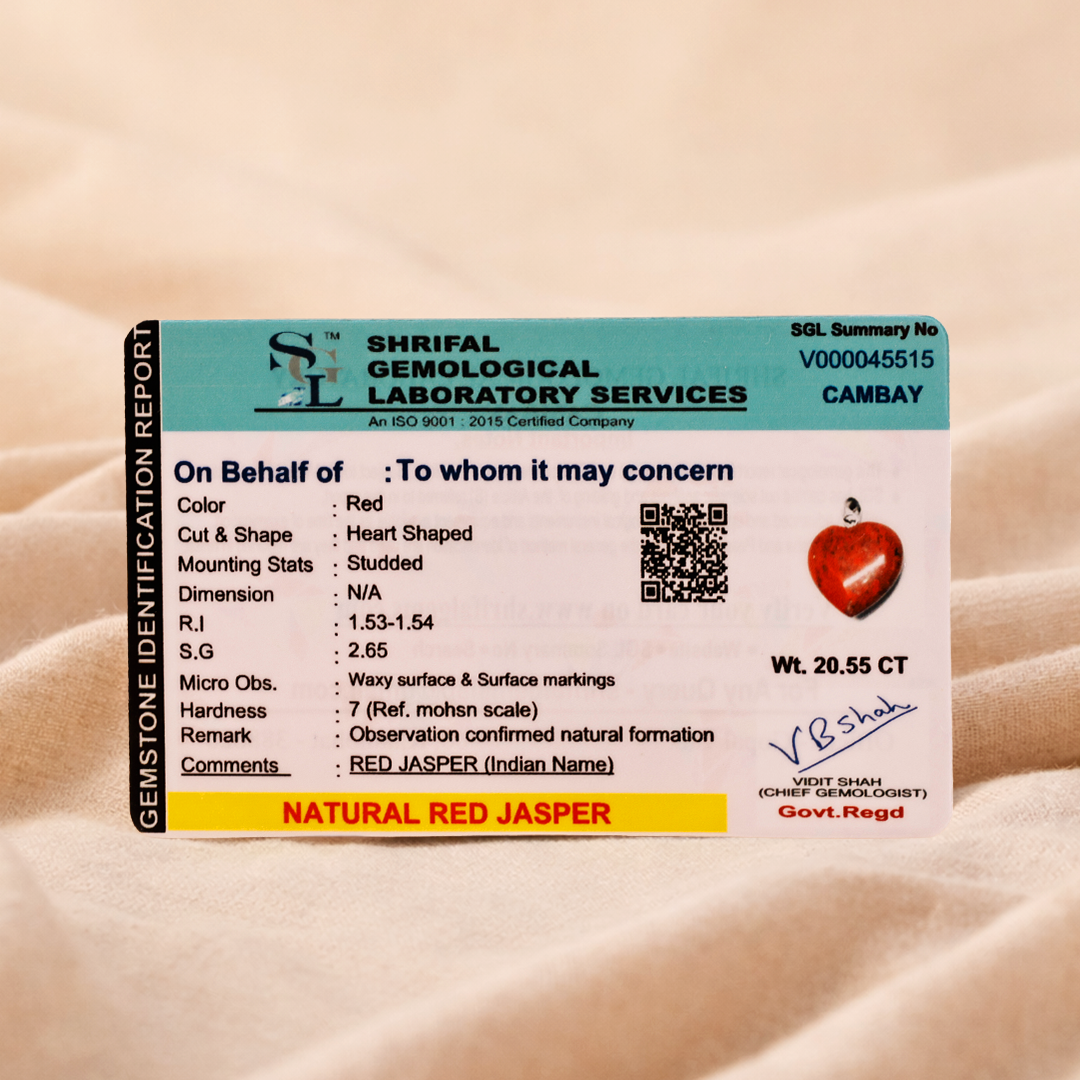 Shrilal Gemological Laboratory Services identification report for a red heart-shaped gemstone on a beige background.