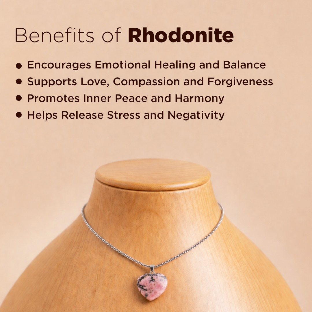 Necklace with a rhodonite pendant on a mannequin against a beige background with text about rhodonite benefits.Rhodonite Heart Pendant (Abhimantrit) for Emotional Healing & Balance
