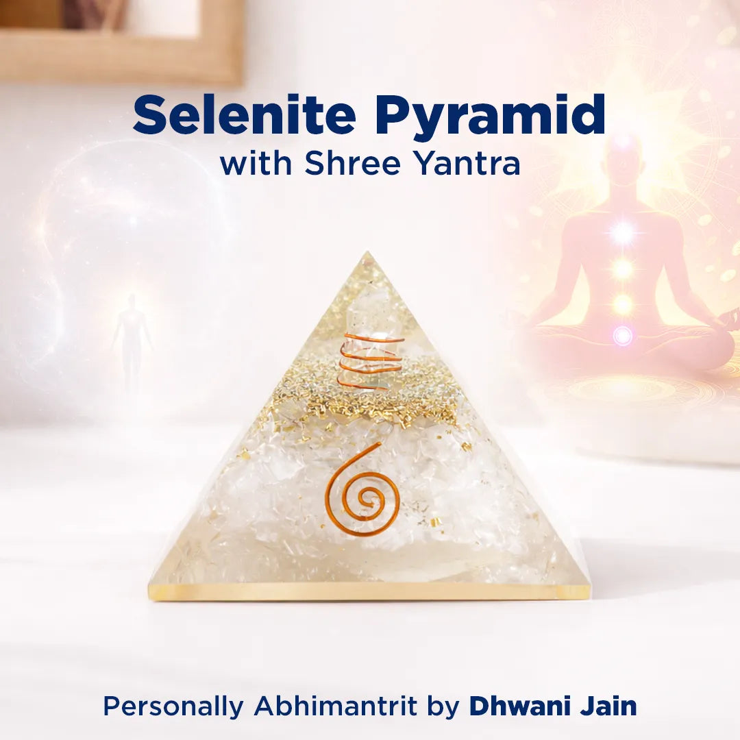 Selenite pyramid with Shree Yantra on a blurred background