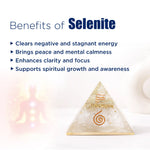 Selenite pyramid with benefits listed on a white background