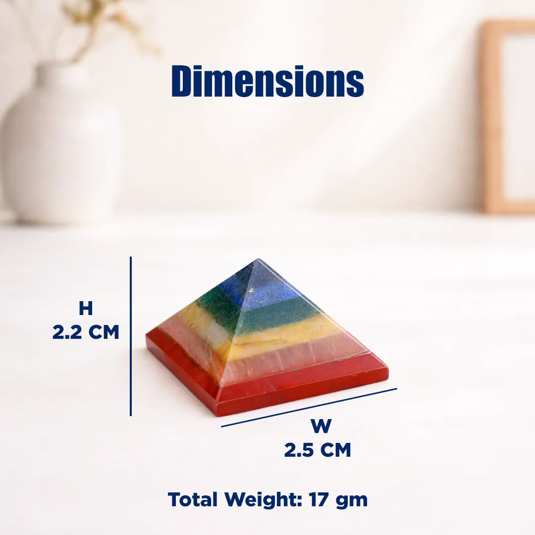 Colorful pyramid-shaped object with dimensions and weight information on a white backgroundSeven Chakra Pyramid (Small) – Energy Balancing & Chakra Healing Crystal