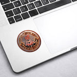 Decorative sticker with intricate design on a laptop