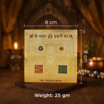 Gold-plated card with measurements and text on a wooden stand