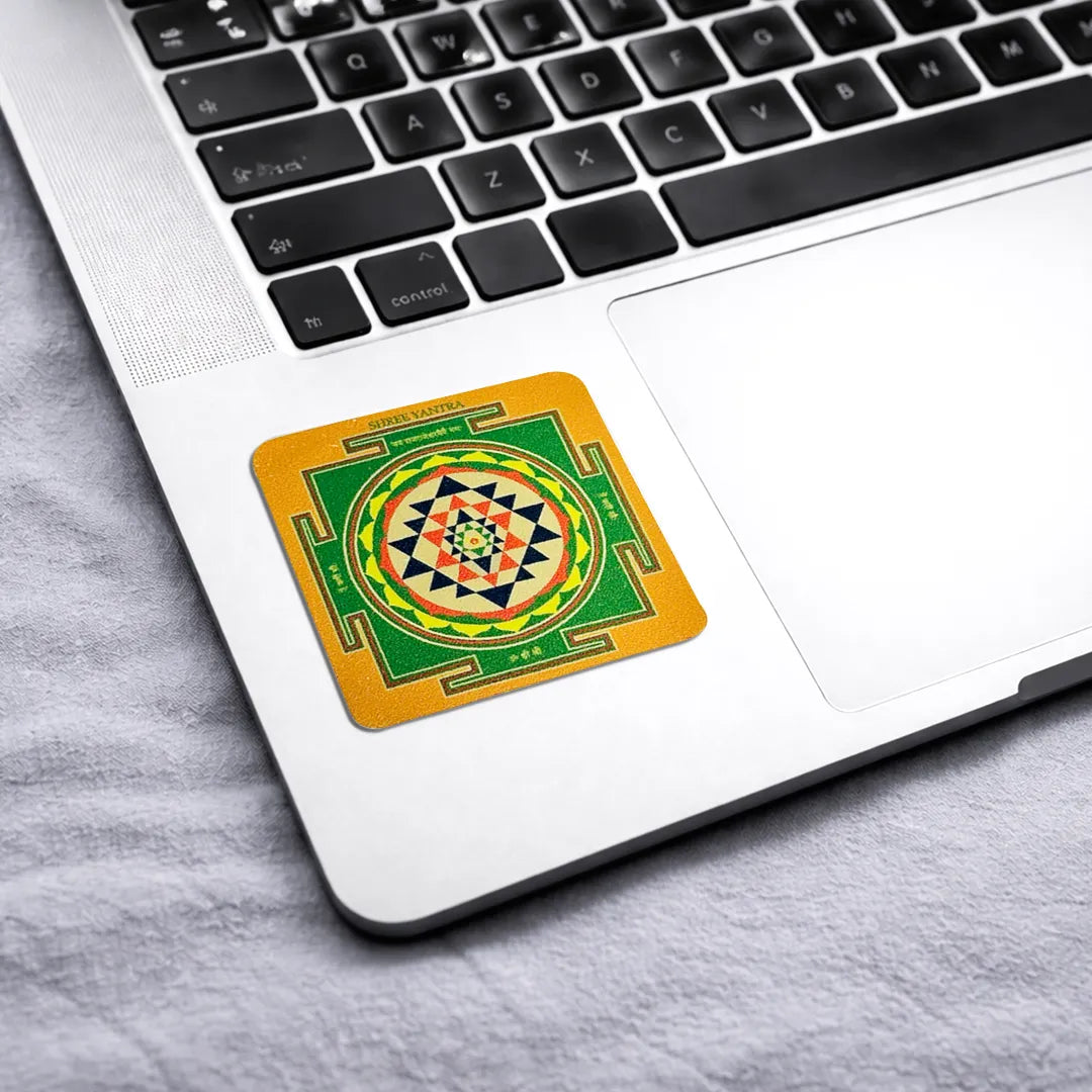 Decorative coaster with a geometric design on a laptopShri Yantra Sticker (Pack of 10pcs) - Prosperity & Vastu Energy Symbol