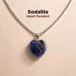 Sodalite heart pendant necklace on a beige background