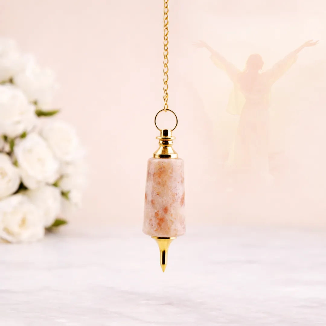 Decorative pendant with marble-like design and gold accents on a soft background