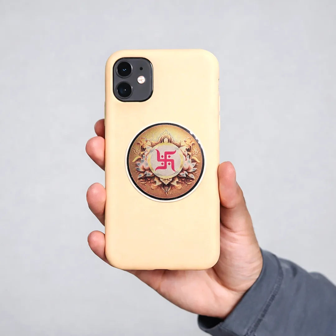 Hand holding a beige phone case with a decorative emblem on a gray backgroundSwastik Sticker (Pack of 10pcs) - Auspicious Swastik Symbol