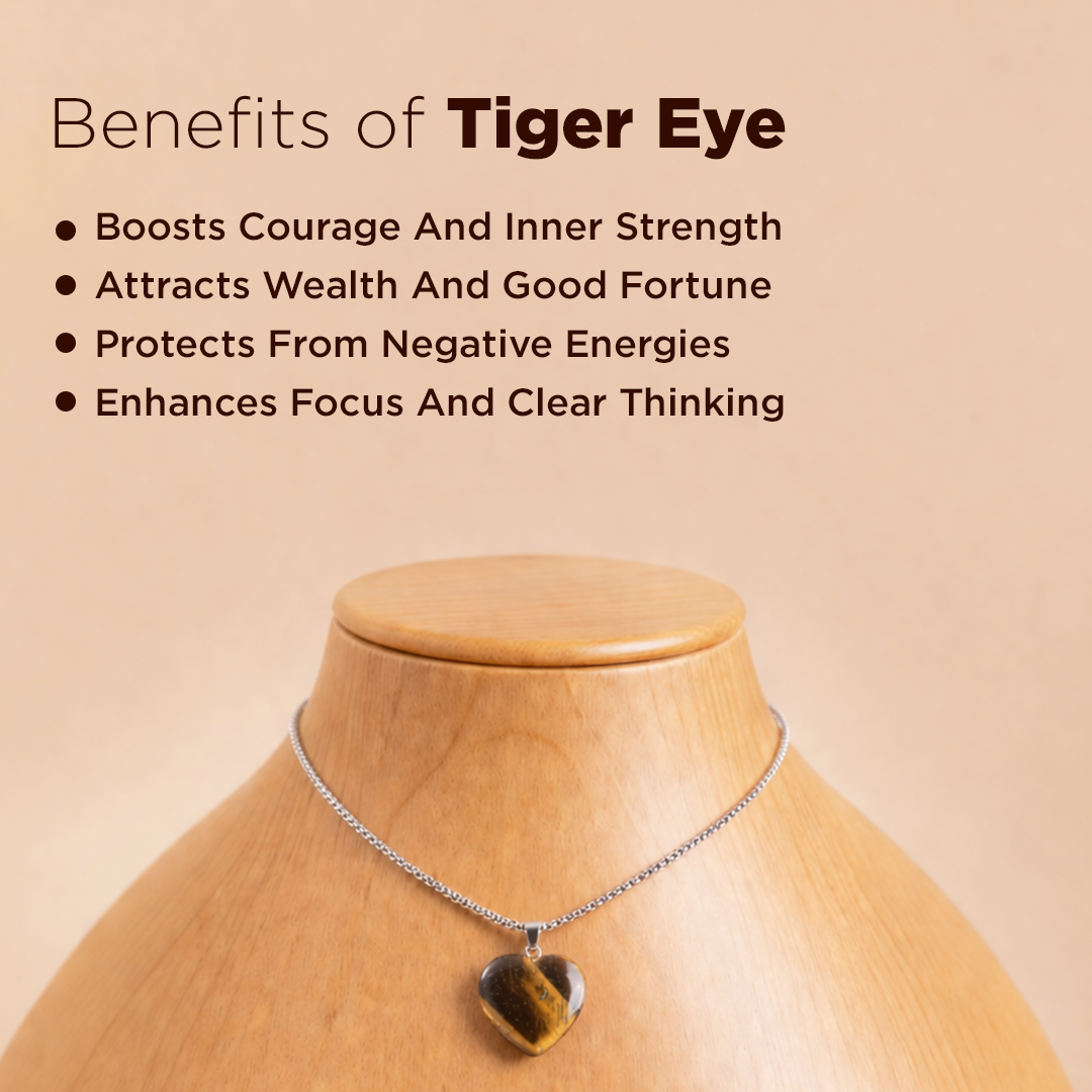 Tiger eye necklace on a mannequin with benefits listed on a beige backgroundTiger Eye Heart Pendant (Abhimantrit) for Confidence & Protection