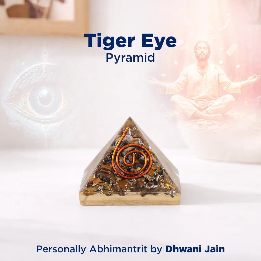 Tiger Eye Pyramid with a person in a meditative pose on a white background