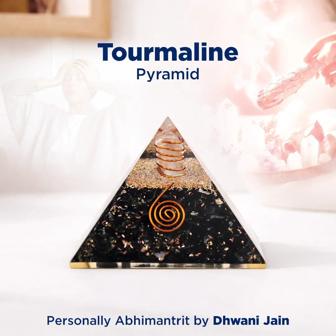Tourmaline pyramid with spiral design on a white surface, branded by Dhwani Jain.
