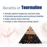 Pyramid-shaped tourmaline product with text listing benefits on a white background