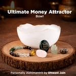 White bowl with crystals and a bracelet on a wooden surface, labeled 'Ultimate Money Attractor Bowl'.
