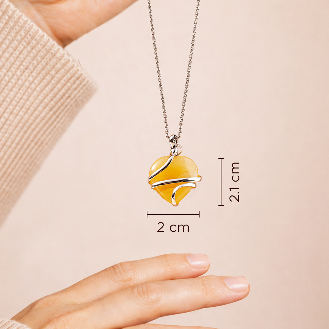 Heart-shaped pendant necklace with measurements on a beige backgroundYellow Aventurine Wrap Heart Pendant (Abhimantrit) for Confidence & Positivity