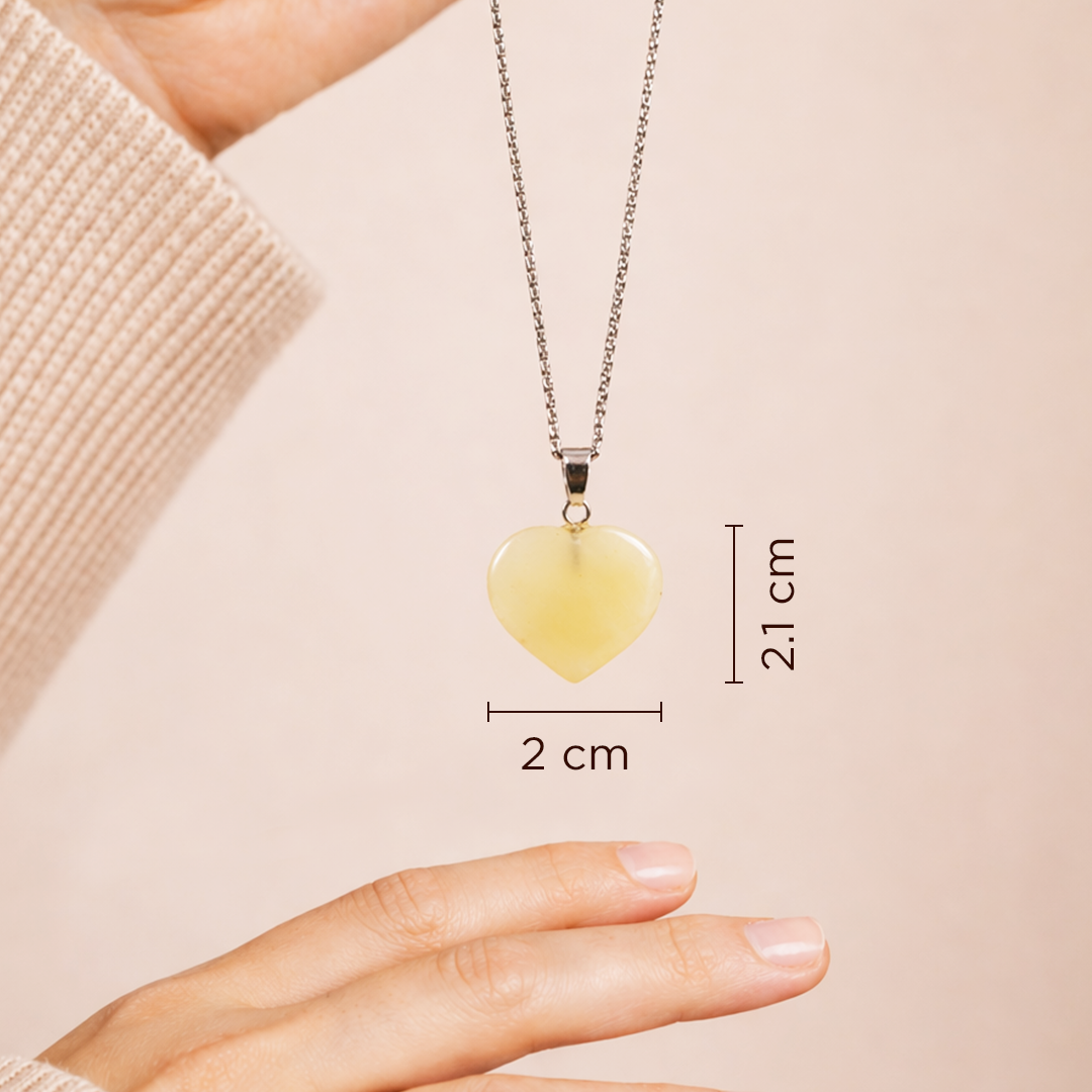 Heart-shaped pendant necklace with measurements on a beige backgroundYellow Aventurine Heart Pendant (Abhimantrit) for Confidence & Positivity