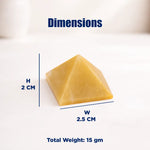 Pyramid-shaped object with dimensions and weight on a white background
