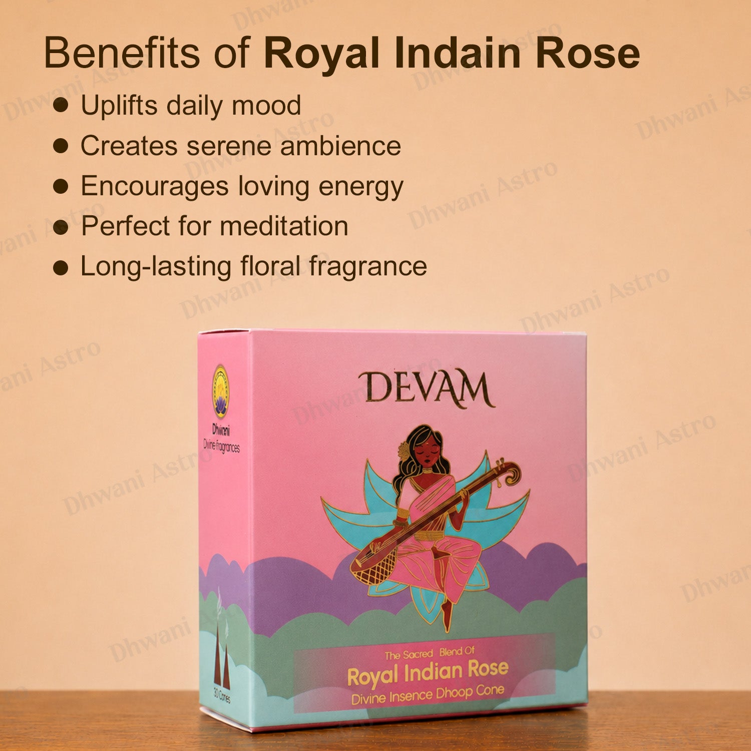 A boxed fragrance product labeled DEVAM Royal Indian Rose stands on a wooden surface against a peach background, with text listing benefits such as uplifting daily mood, serene ambiance, energetic uplift, meditation suitability, and lasting floral fragrance.